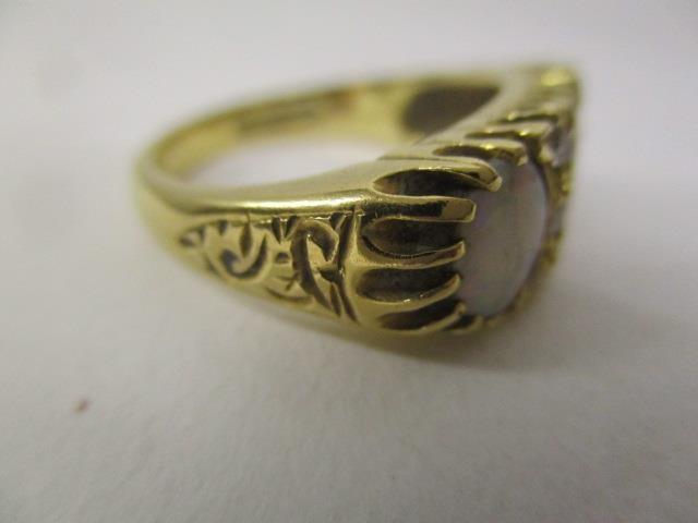 An 18ct gold ring set with three opals and six diamonds in a claw setting, with engraved - Image 3 of 4