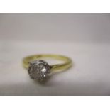 A gold and platinum coloured solitaire diamond ring, approximately 0.3ct stamped 18c B & S, size L/