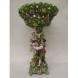 A Schierholz porcelain centrepiece encrusted with leaves and flowers, with a detachable, pierced