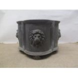 A mid 20th century lobed lead planter, with lion mask ornament, on paw feet, 9 1/4"h x 10 3/4"w