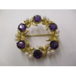 A 9ct gold wreath style brooch set with amethysts and pearls, 7g