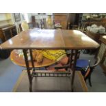 A late Victorian/Edwardian mahogany swivel top Sutherland table 26 1/2"h x 24"l x 28 3/4"d when