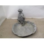 A mid 20th century lead bird bath, fashioned as a shell, surmounted by a boy, 10 1/2" h x 14 1/2"w x