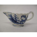 A mid 18th century Bow, Desirable Residence pattern blue and white cream boat, with a wavy rim and