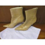 A pair of Jimmy Choo ladies tan ankle, zip up boots, size 39, with 3" stiletto heels together with