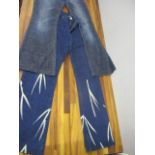 Two pairs of Versace ladies flared jeans, 28" leg, 31" waist, one pair having a bamboo design to the