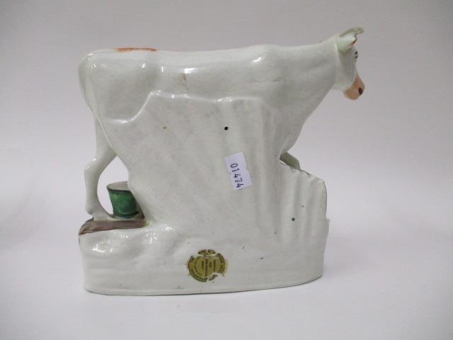 A pair of Victorian Staffordshire pottery flatback models of a boy and a girl each milking a cow, - Image 8 of 12