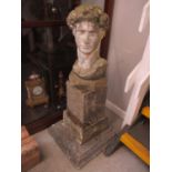 A stoneware bust of David raised on square bases