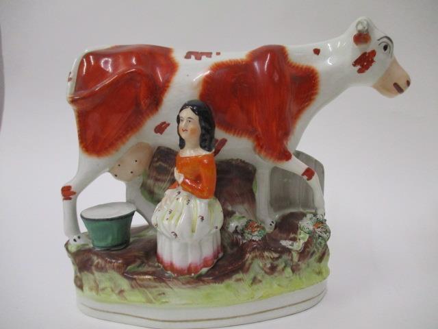 A pair of Victorian Staffordshire pottery flatback models of a boy and a girl each milking a cow, - Image 4 of 12