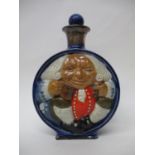 A Doulton Lambeth Toby moon flask decorated in relief with a view of Toby Philpot from the front and