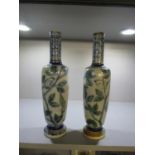 Robert Wallace Martin for Martin Brothers - a pair of stoneware vases of elongated shouldered form