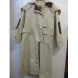 An Australian Driza-bone (dry as a bone) riding coat with a lambswool removable lining, size XS (