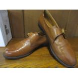 A pair of brand new Russell and Bromley ladies brown leather loafers with buckle design, size 40, in