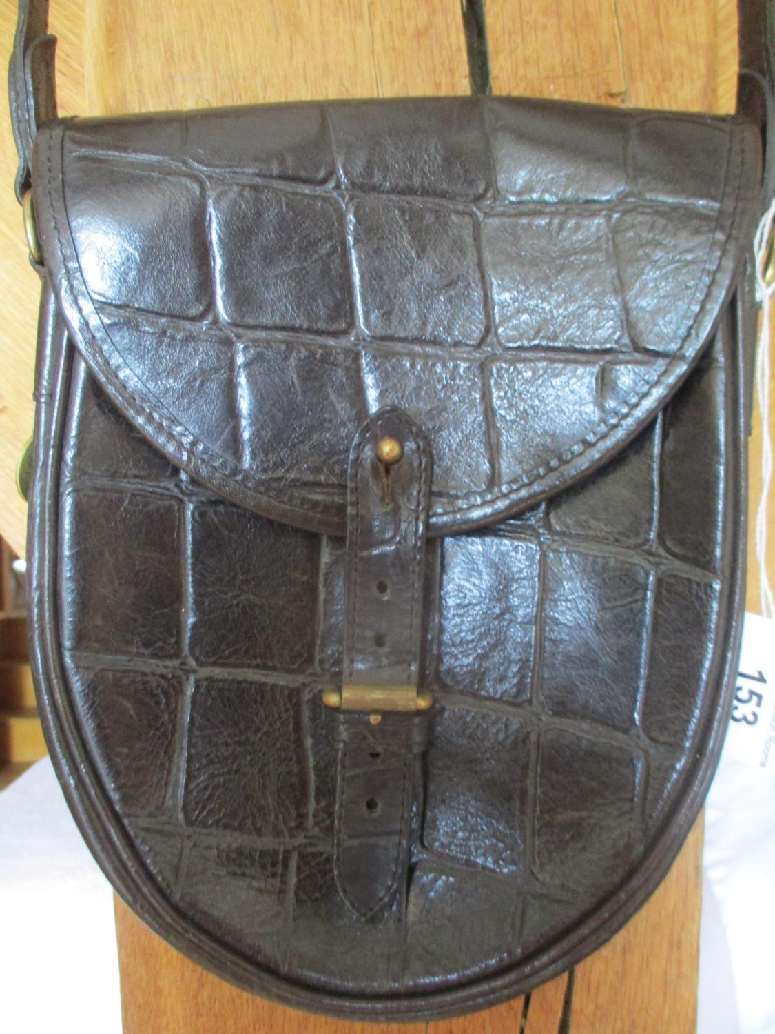 A late 20th century Mulberry black saddle shoulder bag in a crocodile textured leather,