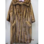 A 1950s/60s three quarter length, brown mink coat with three quarter length sleeves, approximately