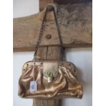 A Mulberry leather and metal gold coloured shoulder bag, serial number 060652, 9"w x 5"h, having a