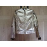 A Retro Versace Versus Pelle Cuir gold coloured leather jacket with a faux leopard print interior