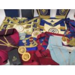 A collection of Masonic regalia to include Middlesex and London lodge sashes, aprons, cuffs and