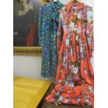 A vintage Nettie Vogues chintz evening dress with a coral coloured background and a turquoise and