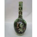 A Della Robbia pottery bottle vase with ovoid body decorated with two swallows, amongst acorns and