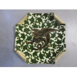 A 19th century European ceramic square plate with scrolled turn over corners decorated with a dragon