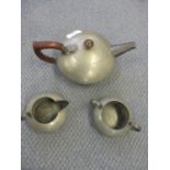 A Tudoric Liberty three piece pewter tea set