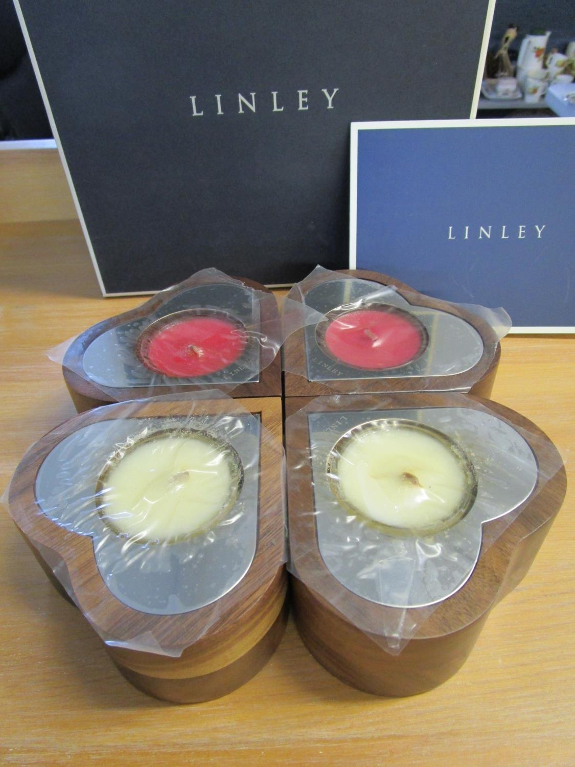 David Linley - a set of four heart shaped tea lights in walnut and polished nickel, boxed