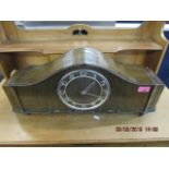 A walnut cased mantle clock with Arabic numerals and Westminster chimes