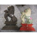 Two cast iron lion door stops, on painted, 14" h