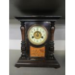 A late 19th century HAC German 14 day striking mantle clock in an ebonized case, with a floral