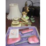 A mixed lot to include two handbags, a Koala table lamp, two dressing table sets and other items