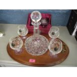 A crystal cut glass set to include a decanter with tray with four glasses and two boxed brandy