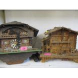 A mid 20th century cuckoo clock and a treen box in the form of an Austrian chalet