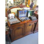 A Victorian mahogany Chiffonier having a raised, mirrored back, two drawers and cupboards below, 59"