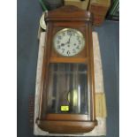 A mahogany cased Vienna style wall clock, with a silvered dial and Arabic numerals and three winding