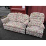 A floral upholstered sofa, together with a matching recliner armchair