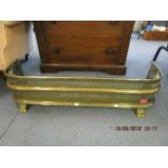 A late Victorian/ Edwardian brass fire fender