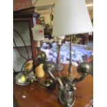 A pair of early 20th century brass wall lights, a table lamp and a pair of mid 20th century treen