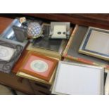 A selection of photo frames, together with a Tiffany style shade