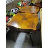 A pair of Weimar American reproduction inlaid mahogany lamp tables, on curved legs