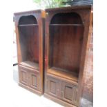 A pair of modern stained pine tall bookcases having panelled cupboard doors below, 80"h x 34"w