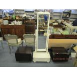 A pair of modernist bedside tables on metal tapering legs, along with a white painted pine cheval