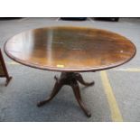 A Georgian oak circular topped table standing on four cabriole legs, 30" h x 48"w