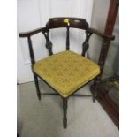 A Victorian mahogany corner chair having turned supports