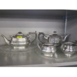 Two cut glass trays, together with a silver plated three piece teaset and one other teapot