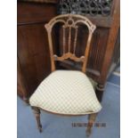 A Victorian walnut side chair with upholstered seat on turned and fluted legs