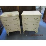 A pair of Harrods white painted bedside cabinets having three drawers on drench cabriole legs, circa