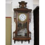 A late 19th century mahogany wall clock