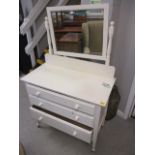 An early 20th century white painted dressing table having a swing mirror A/F, above three long