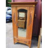 A late Victorian satinwood wardrobe with a mirrored door and carved, panels and a similar three door